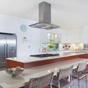 Modern kitchen with stainless steel appliances in Australian mansion